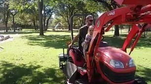 'Aerating the lawn. Kubota BX2660. Field Tuff 48\" aerator.'