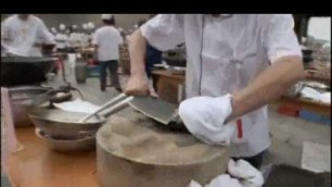 'Speed Cooking- serving live snake and fish'