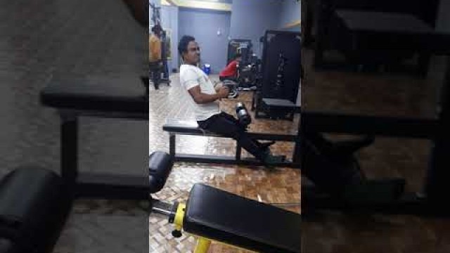 'Asian Fitness Gym..doing back exercise'