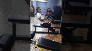 'Asian Fitness Gym..doing back exercise'
