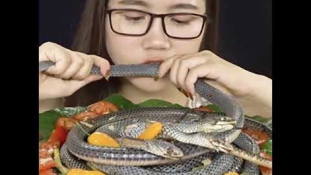 'Chinese girl eating snake amazing video'