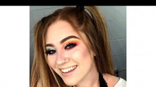 'This is a dual eyeshadow look using warm and cool colors! Pink, orange, yellow, purple, blue, green!'