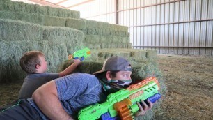 'Using nerf guns on the farm | Stopping the bad guy from taking our hay | Nerf gun for kids'