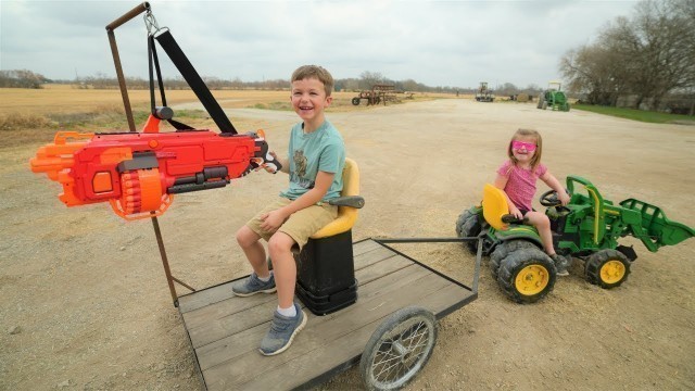 'Using nerf gun tractor to stop a bad guy | Tractors for kids'