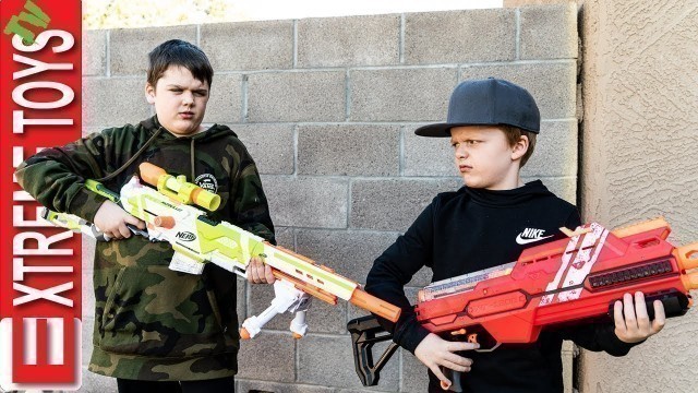 'New Nerf Blaster Battle! Ethan Attacks Cole with Nerf Modulus Longstrike.'