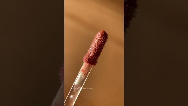'close-up + #swatch of the @colourpopcosmetics lux #lipoil in hot shot