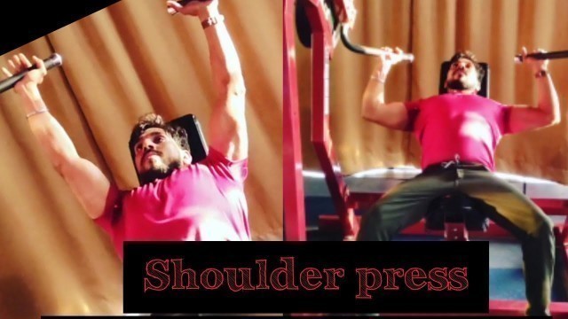 'shoulder press machine workout@light weight@gym'
